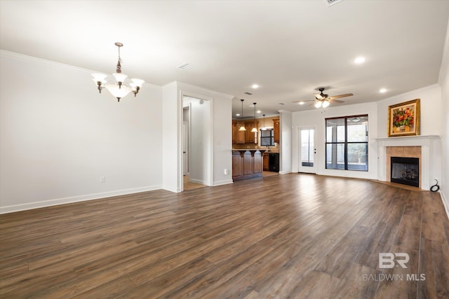 unfurnished living room with dark hardwood / wood-style flooring, ceiling fan with notable chandelier, and ornamental molding