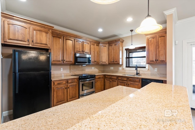 kitchen featuring pendant lighting, crown molding, sink, and black appliances