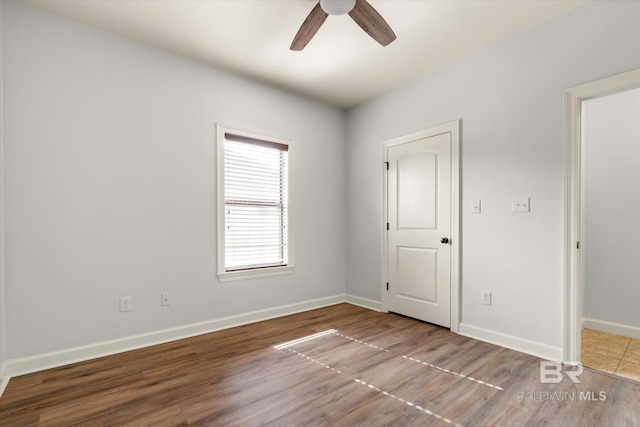 unfurnished bedroom featuring wood-type flooring and ceiling fan