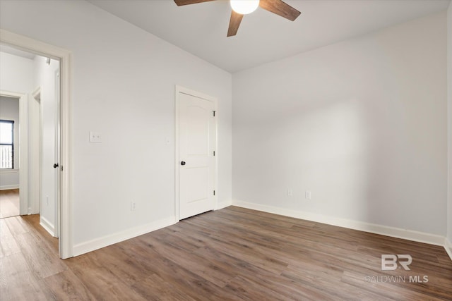 interior space with hardwood / wood-style floors and ceiling fan