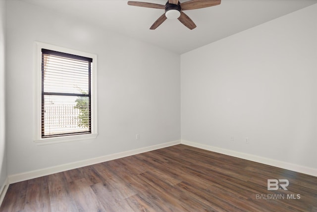 unfurnished room with dark wood-type flooring and ceiling fan