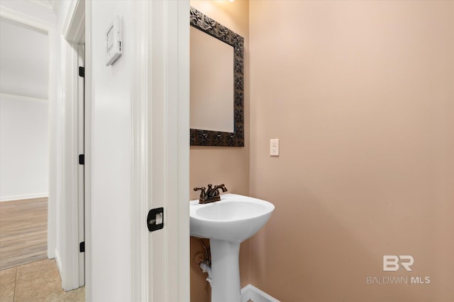 bathroom with tile patterned floors