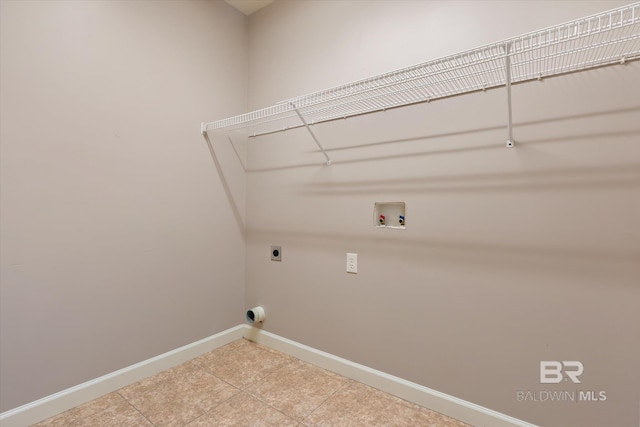 laundry area with hookup for a washing machine, tile patterned flooring, and hookup for an electric dryer