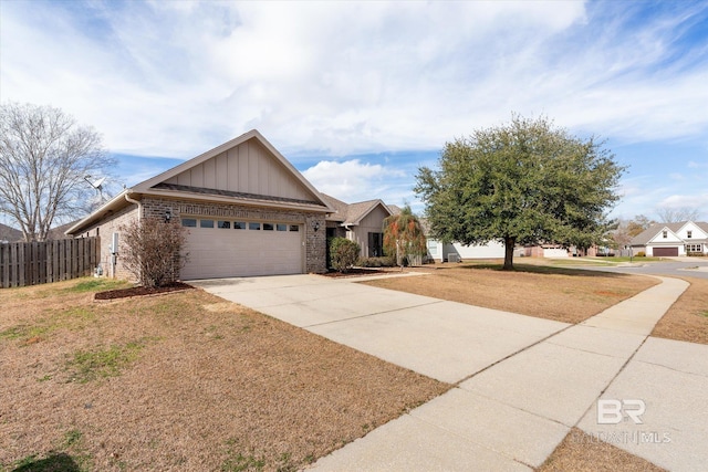 view of front of house with a garage and a front lawn