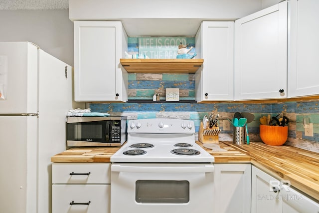 kitchen with white cabinetry, white appliances, and wooden counters