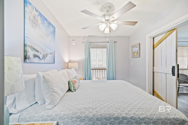 bedroom featuring a textured ceiling and ceiling fan