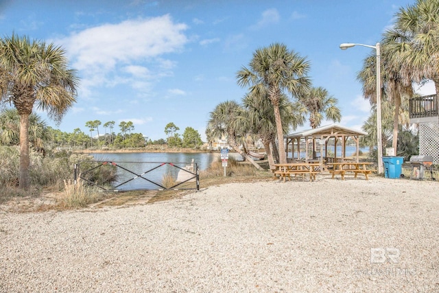 exterior space with a water view and a gazebo