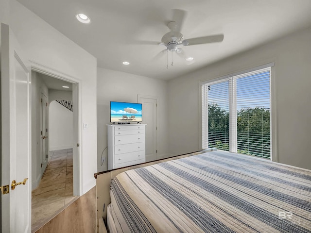 bedroom featuring light tile patterned flooring and ceiling fan