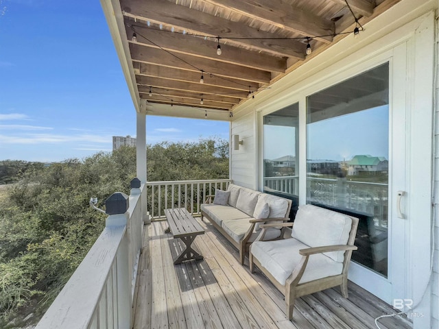 wooden deck with an outdoor living space