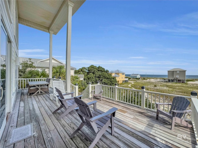 wooden terrace with a water view