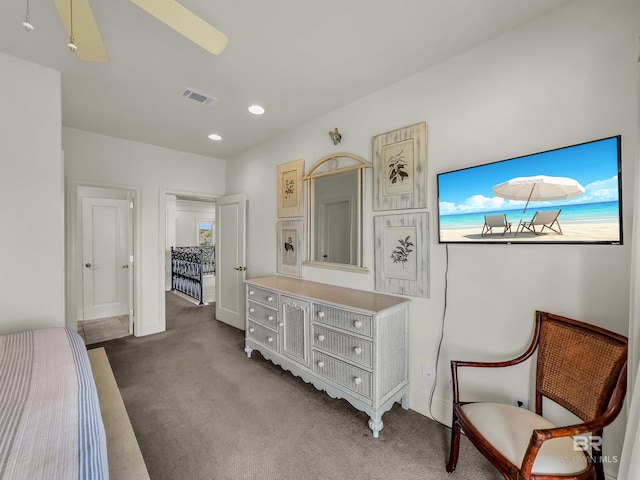 interior space featuring carpet and ceiling fan