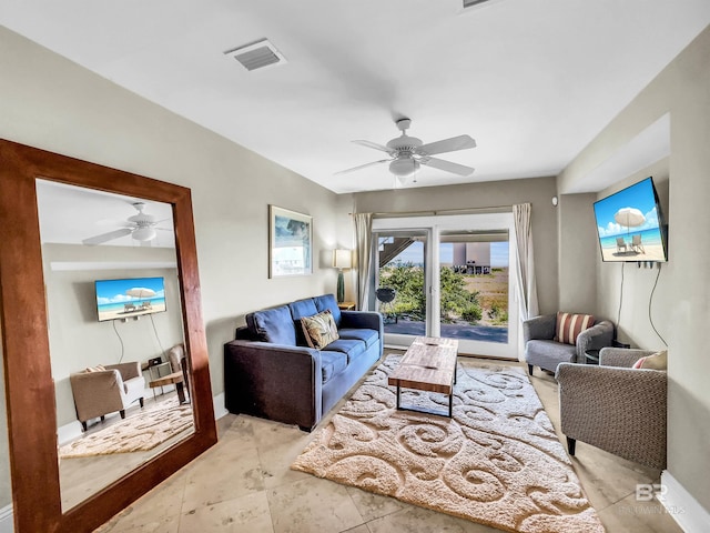 tiled living room with ceiling fan