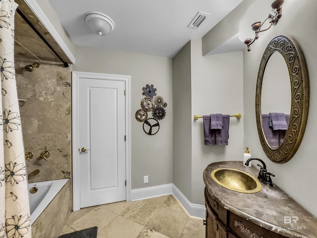 bathroom featuring vanity, shower / bath combo with shower curtain, and tile patterned floors