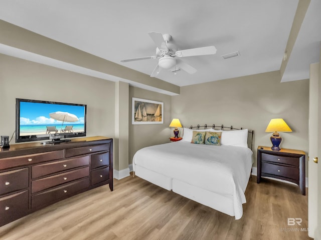 bedroom with ceiling fan and light hardwood / wood-style floors