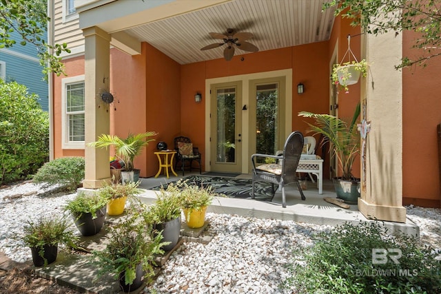 1430 Regency Rd Unit C103, Gulf Shores, AL 36542 - entrance to property with ceiling fan, stucco siding, and a patio area