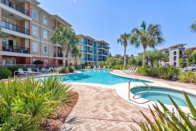 1430 Regency Rd Unit C103, Gulf Shores, AL 36542 - community pool featuring ceiling fan, a community hot tub, and a patio
