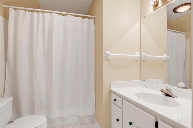 bathroom with a shower with shower curtain, tile patterned floors, vanity, and toilet