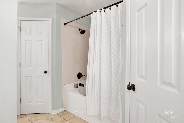 bathroom with a textured ceiling, shower / bathtub combination with curtain, and tile patterned floors