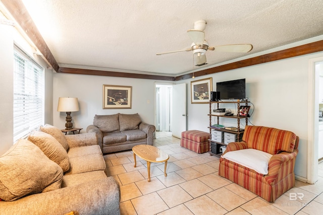 tiled living room with ceiling fan and a textured ceiling