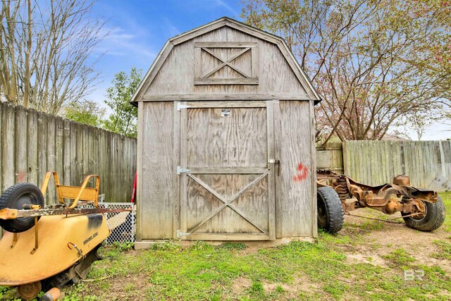 view of shed with a fenced backyard