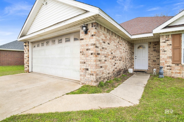 property entrance featuring brick siding, an attached garage, driveway, and a shingled roof