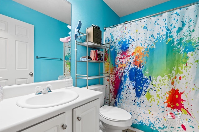 bathroom featuring vanity, toilet, and a shower with curtain