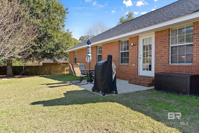 view of yard featuring entry steps, a patio area, and fence