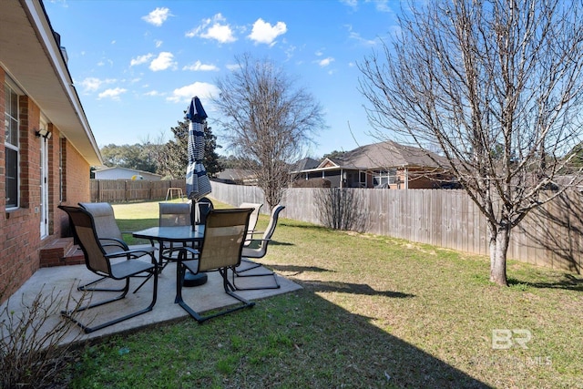 view of yard featuring a patio and a fenced backyard