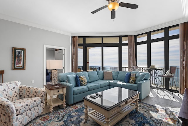 tiled living room with crown molding, ceiling fan, and floor to ceiling windows