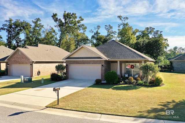 view of front of house with a front yard and a garage