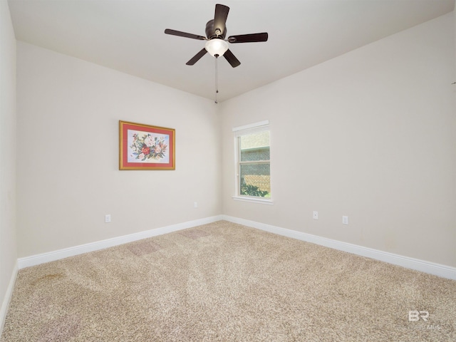 spare room with carpet flooring and ceiling fan