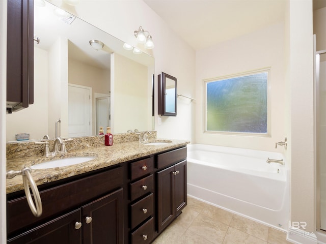 1234 Surrey Loop, Foley, AL 36535 - bathroom with a garden tub, double vanity, and tile patterned flooring