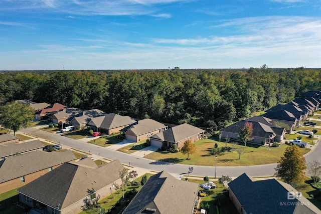 1234 Surrey Loop, Foley, AL 36535 - aerial perspective of suburban area featuring a heavily wooded area
