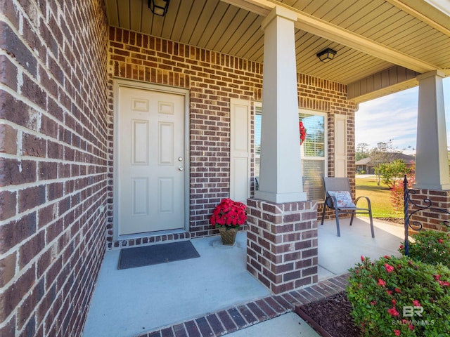 1234 Surrey Loop, Foley, AL 36535 - view of exterior entry featuring a porch and brick siding