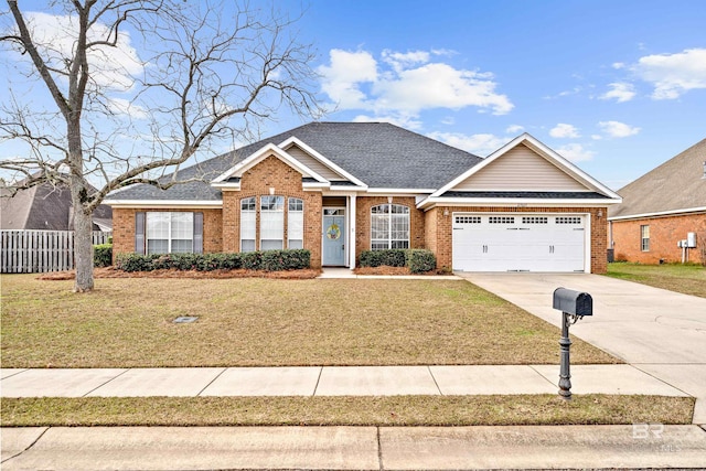 view of front of property with a garage and a front lawn