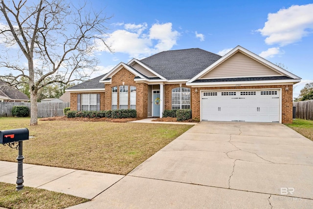 view of front facade featuring a front yard and a garage