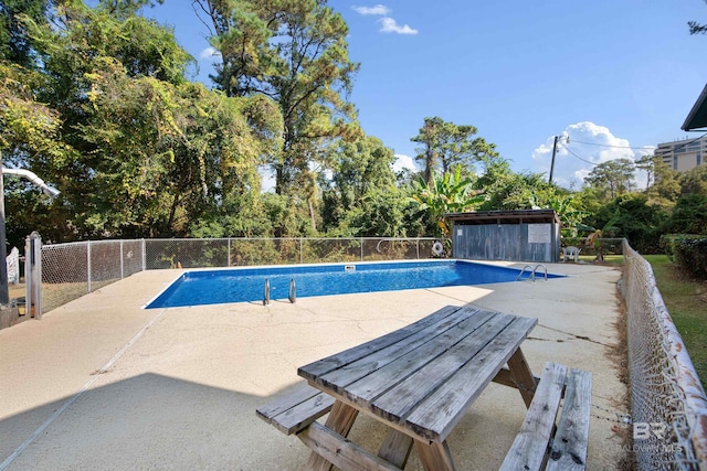 view of pool featuring a patio