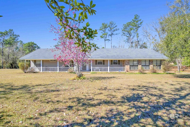 single story home featuring a porch and a front lawn