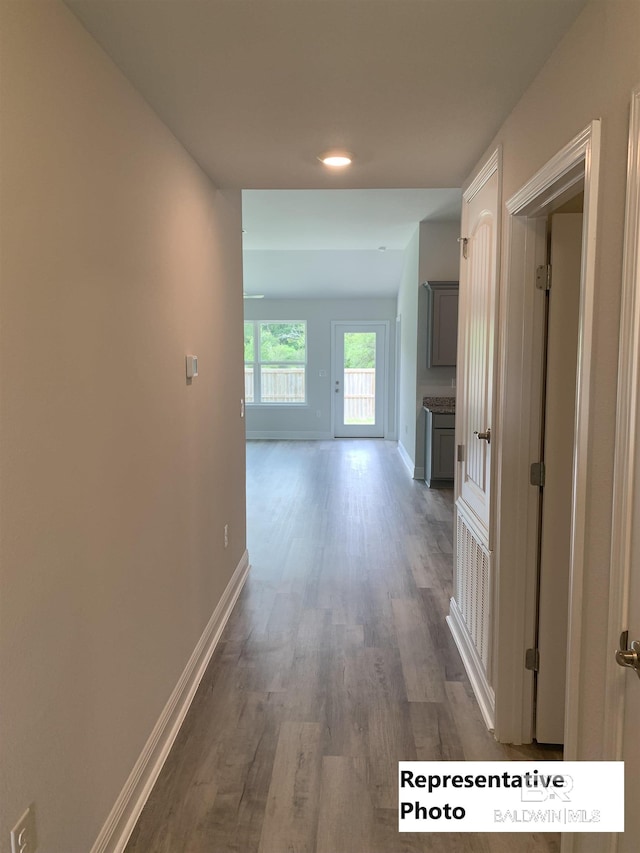 corridor featuring hardwood / wood-style floors