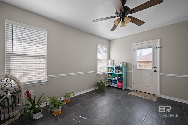 129 Oakwood Ave, Fairhope, AL 36532 - foyer entrance featuring baseboards, a ceiling fan, and dark tile patterned floors