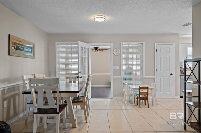 129 Oakwood Ave, Fairhope, AL 36532 - dining space featuring ceiling fan, plenty of natural light, a textured ceiling, and light tile patterned floors