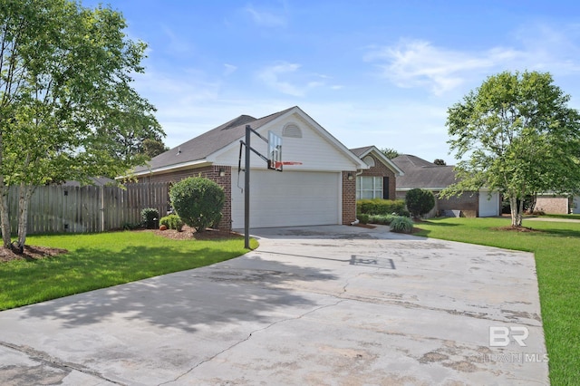 129 Oakwood Ave, Fairhope, AL 36532 - view of front of home featuring brick siding, an attached garage, and driveway