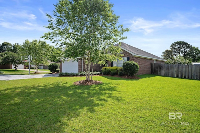 129 Oakwood Ave, Fairhope, AL 36532 - view of front of home featuring concrete driveway, brick siding, and a garage
