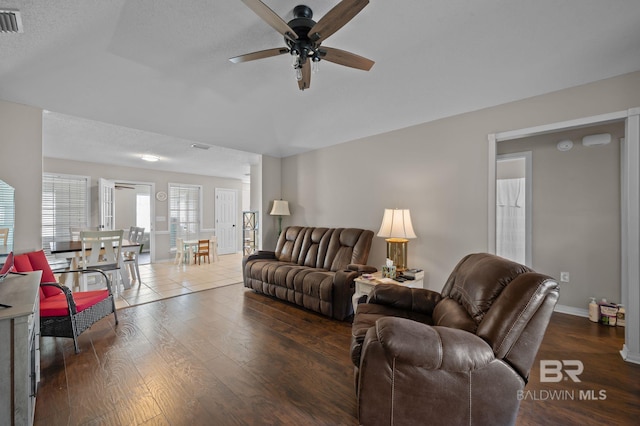 129 Oakwood Ave, Fairhope, AL 36532 - living area featuring ceiling fan, wood finished floors, and baseboards