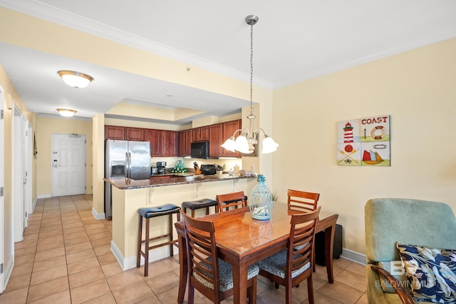 dining room with an inviting chandelier, crown molding, baseboards, and light tile patterned floors