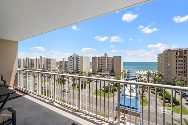 balcony with a view of city and a water view