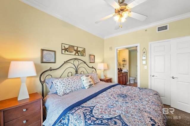 carpeted bedroom featuring connected bathroom, visible vents, crown molding, and a ceiling fan