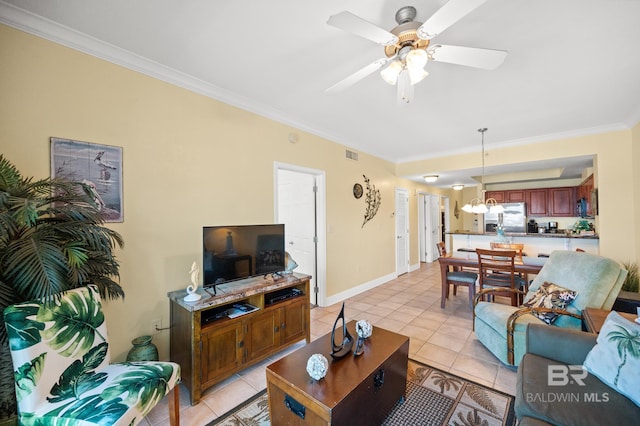 living area with light tile patterned floors, visible vents, baseboards, ornamental molding, and ceiling fan with notable chandelier