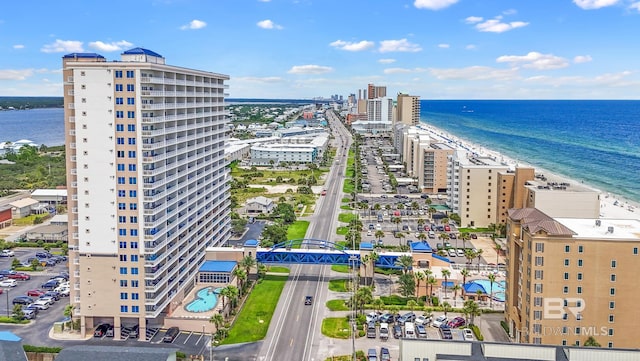 birds eye view of property with a water view, a city view, and a view of the beach