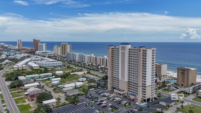 drone / aerial view featuring a water view and a city view